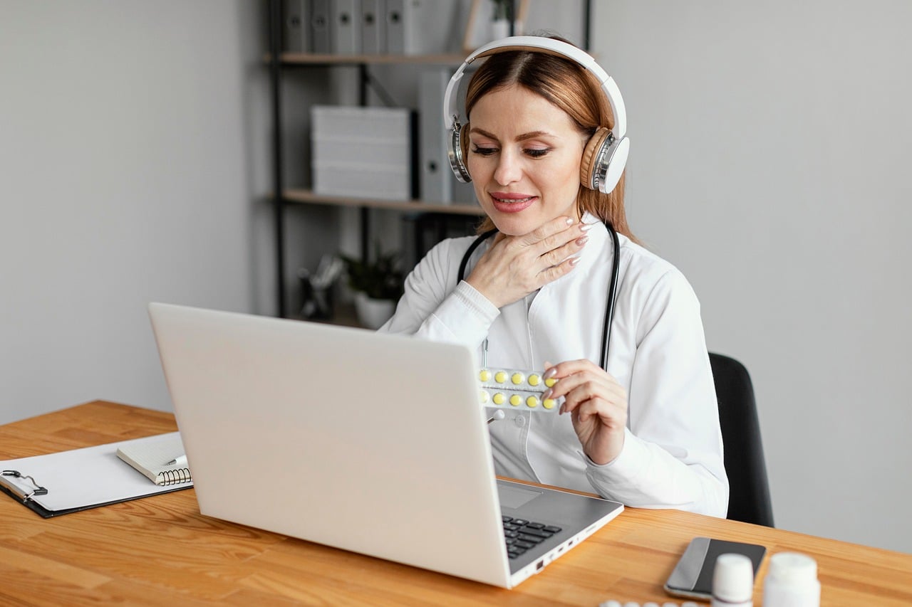 doctor, headphones, capsules, video call, computer, desk, workspace, healthcare, telemedicine, medication, sore throat, home office, video conferencing, communication, general practitioner, medical care, diagnosis, medical consultation, woman, online services